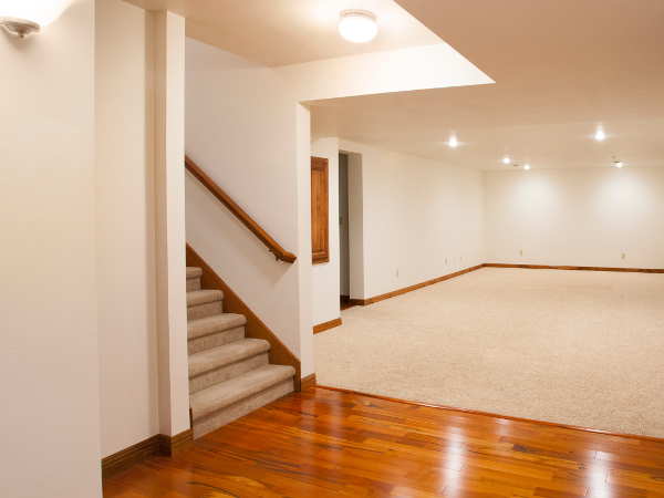 Hardwood and carpet floors in a large room