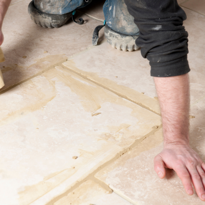 Applying grout to tile flooring