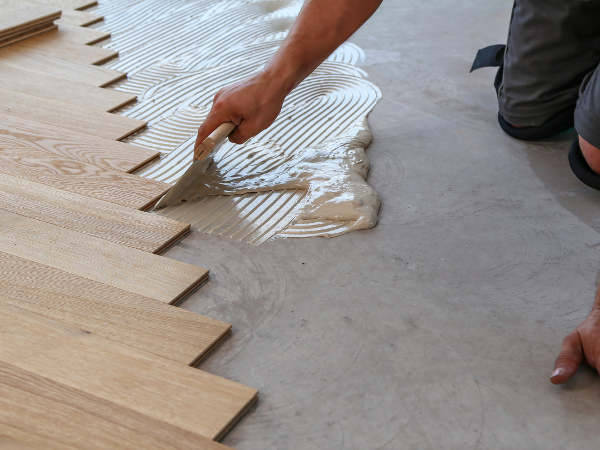 Flooring contractor installing plank floors