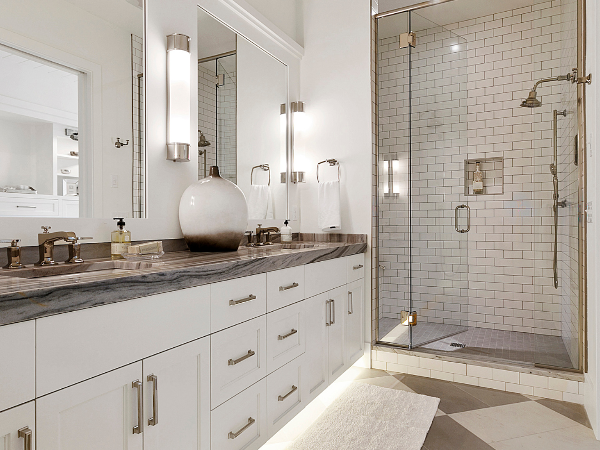 Alternating colors of grey and white tile in a modern bathroom