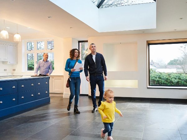 Young family and realtor in an open house