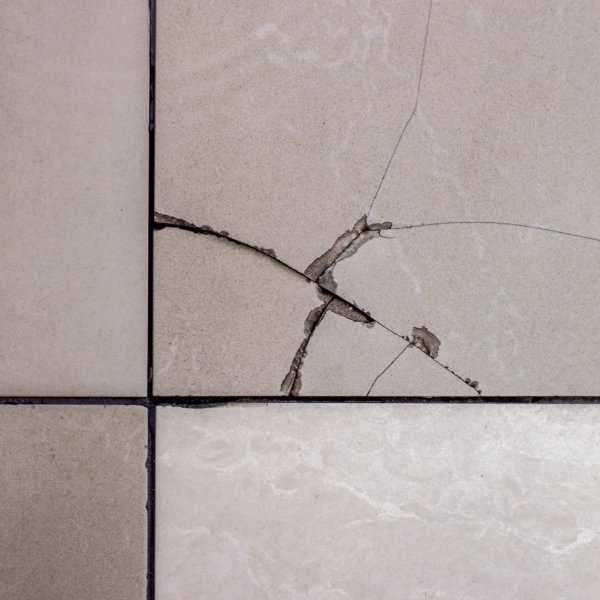 Cracked Tile Floors with Water Damage