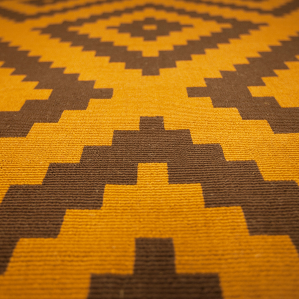 yellow and brown patterned carpet