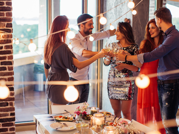 House party in a warmly lit dining area