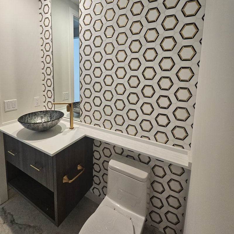 Geometric tile walls in a Florida bathroom